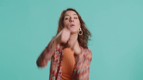 Determined Woman Posing with Punching Gesture