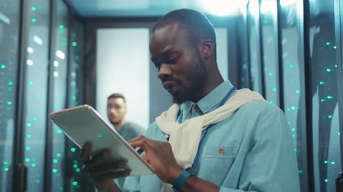 A Modern Professional is Utilizing a Tablet in an Advanced Hightech Working Environment