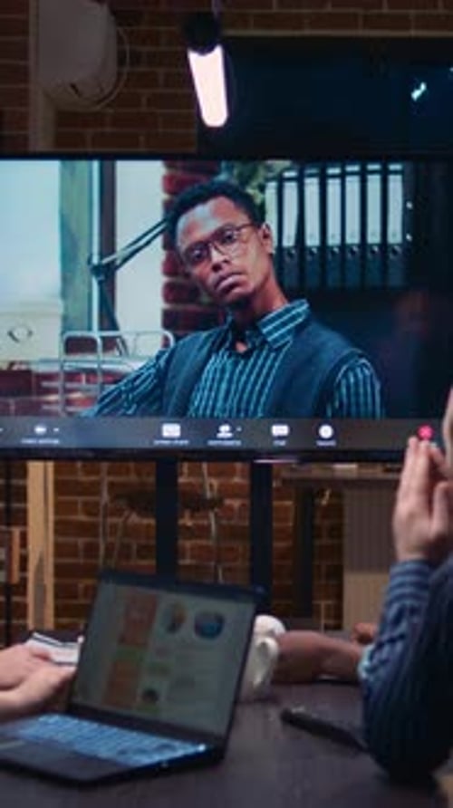 Business Meeting with Remote Colleague in Office