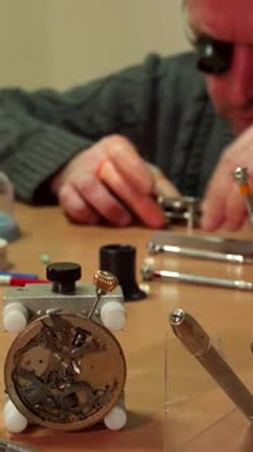 Dedicated Watchmaker Skillfully Repairs an Intricate Repeater Timepiece
