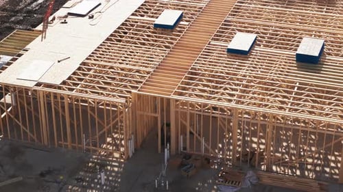 Aerial View of Building Construction Framework on Sunny Day