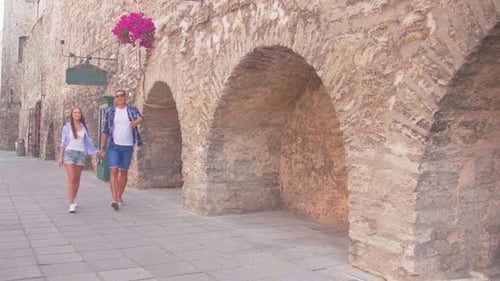 Couple of Tourists Traveling and Exploring Beautiful Old Town Loving Man and Woman in a Vacation