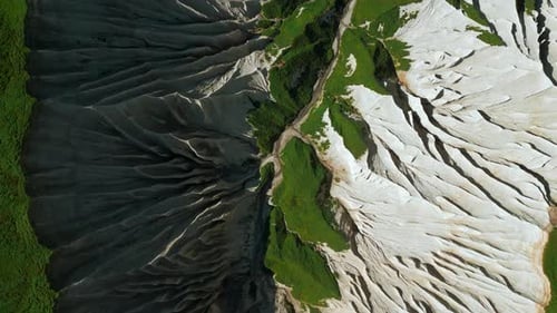 Top View of Picturesque Mountain Peak Clip Frozen Stone Formations and Green Grass