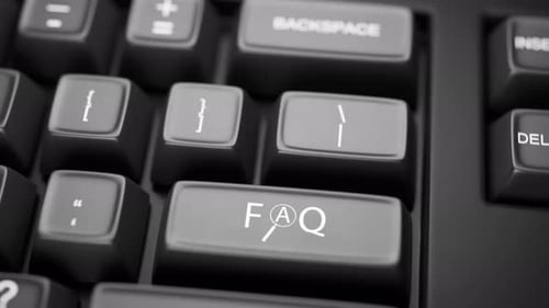 Pressing FAQ Key on Grayscale Computer Keyboard