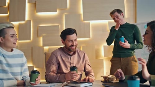 Happy Office Coworkers Enjoy Coffee Break Sitting at Desk Conference Room Close