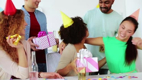 Corporate, Celebration And People Concept - Happy Team With Gifts Greeting Colleague At Office Bi...