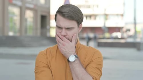 Pensive Young Man Thinking having New Idea Outdoor