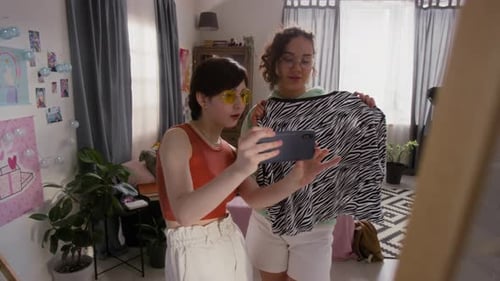 Two Women Taking a Picture of a Zebra Top