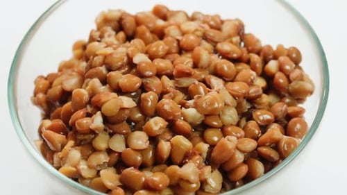 Lentils Macro Open Metal Can with Preserved Steamed Brown Lentils Close Up Isolated on White