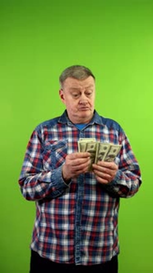 Adult Man Counting Money on Green Screen