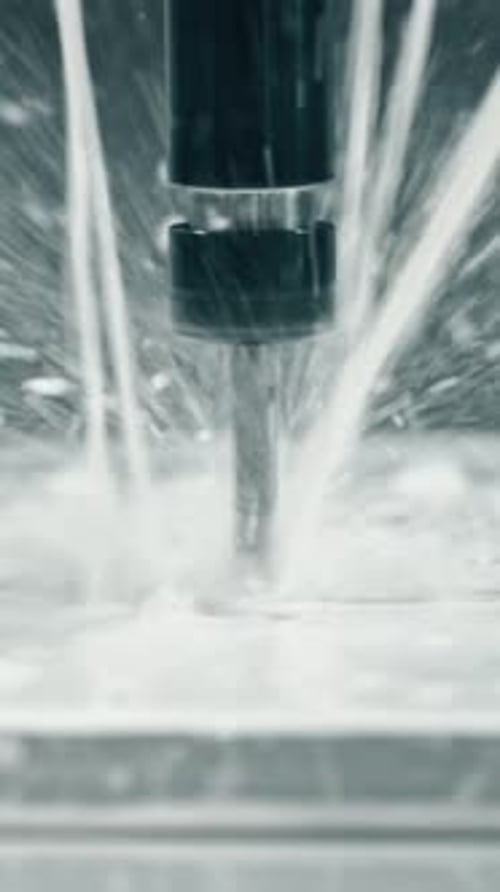Fast cnc milling process with coolant splashing on metal