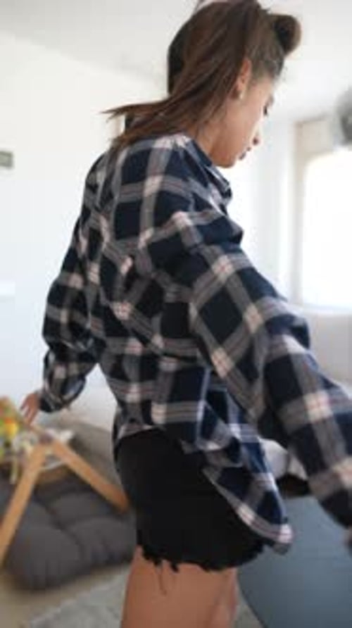 Carefree Woman Dancing in Her Apartment