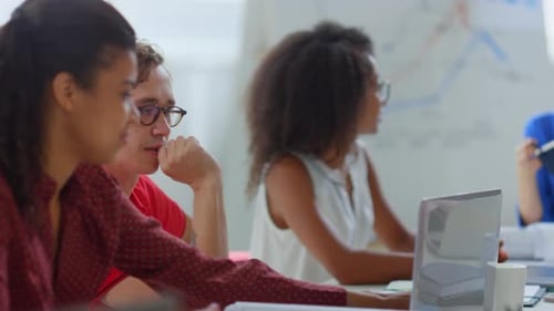 Coworkers having a Business Meeting in Bright Office