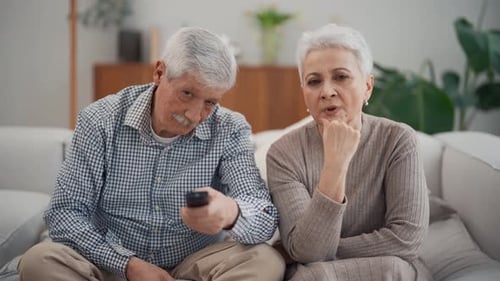 Senior Couple Relaxing on Couch at Home