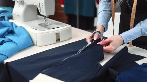 Female Seamstress Hands Cutting Textile Pattern Details Use Scissors Working at Tailoring Atelier