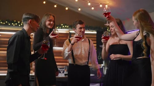 Friends Toasting with Wine at Birthday Party