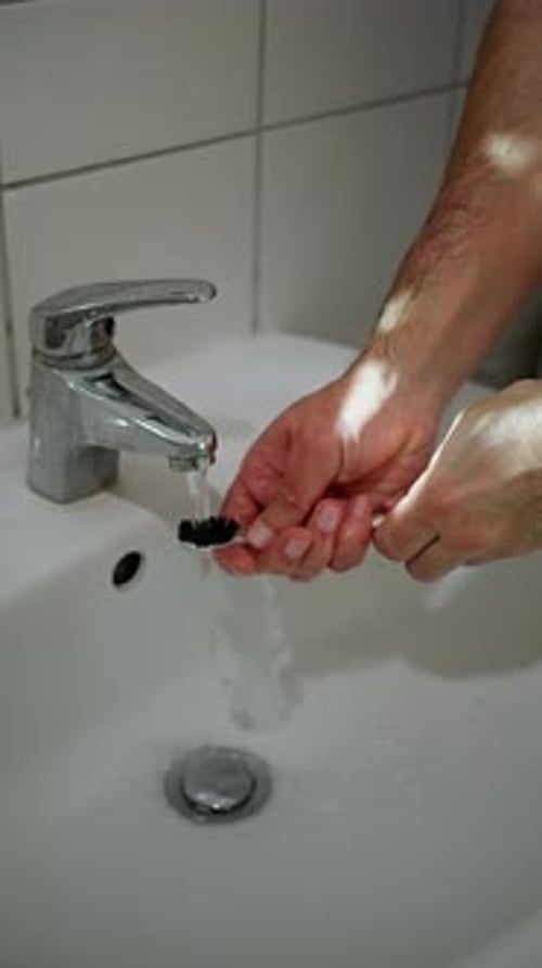 Person Rinses And Disinfects Toothbrush Individual Carefully Cleans And Disinfects Dental Tool
