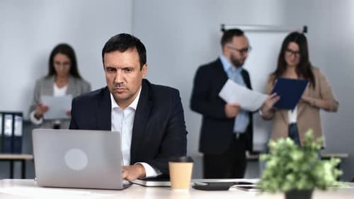 Pensive Male Boss in Suit Working Office Desk Modern Routine Workspace Laptop Communication Career