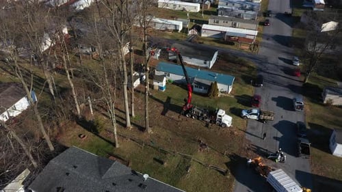 Crane Operating in a Suburban Neighborhood Aerial Shot