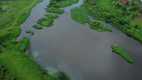 A Stunning Aerial View of a Serene River Beautifully Surrounded By Lush Greenery and Nature Stock