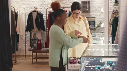 Woman Choosing Accessories in Expensive Designer Boutique