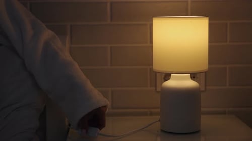Close Up Hands Turning Off Light Control