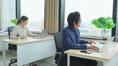 Group of Asian attractive business people working together in the office workplace.