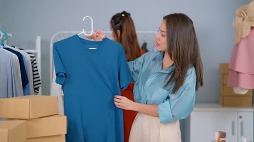 Woman Presenting Fashion Apparel in Studio Setting