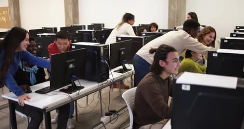 Young Multiracial Students Using Computer Inside Classroom at University Academic