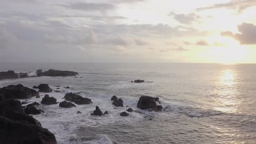 Rocky Shoreline at Golden Sunrise, Aerial View