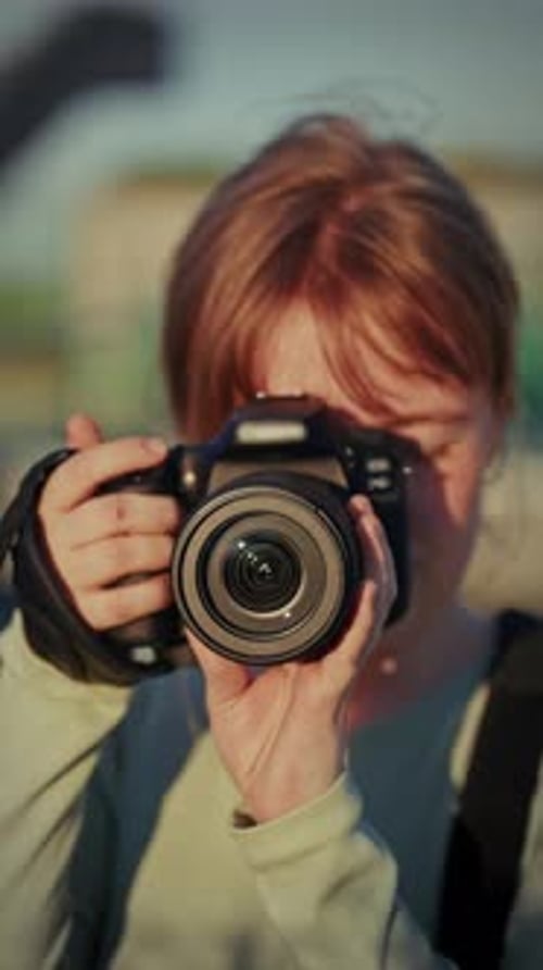 Photographer Taking Photos in the City with Camera