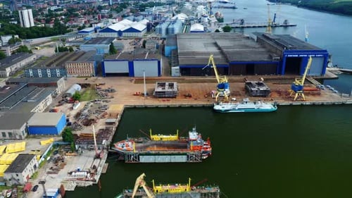 Aerial View Of Cargo Ship Terminal And Warehouse On The Coast Of Baltic Sea. Port Of Klaipeda In Kla