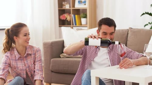 Couple Celebrates with Pizza and Wine at Home