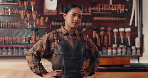 Leather work, portrait of confident woman in workshop with tools and manufacturing of unique textile