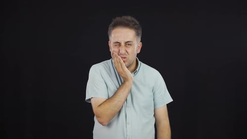 Man with toothache.
