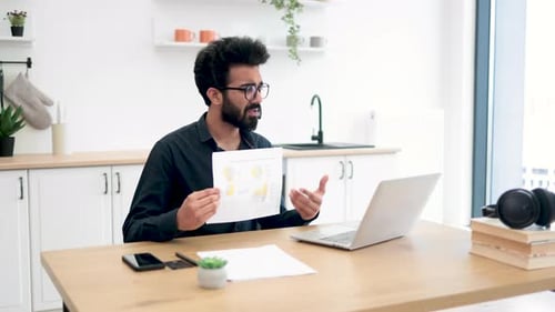 Young Adult Presenting Charts on Video Call