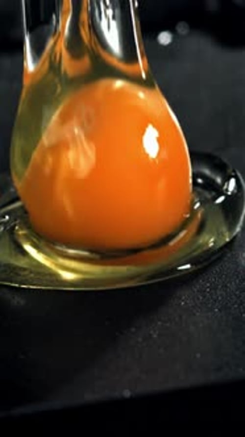 The Broken Egg Falls Into the Pan Filmed on a Highspeed Camera at 1000 Fps