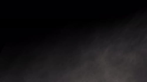 Abstract Smoke Drifting on Black Background