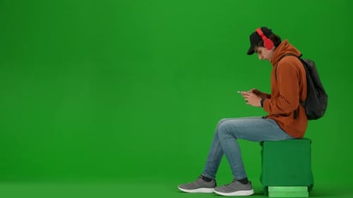 Portrait of Traveler Isolated on Chroma Key Green Screen Background Man in Casual Clothing Puts