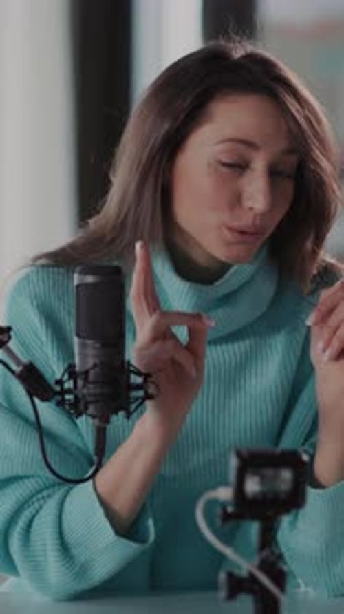 Woman Vlogging or Podcasting at Home