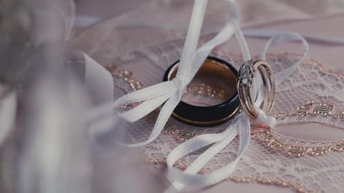 Wedding Ring - Groom And Bride Wedding Band With Ribbons. - close up, rack focus