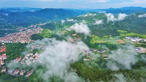 View From Rock to Town of Smolyan with Meadows for Cattle Walking and Houses Between Mountain Range
