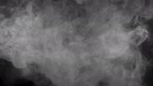 Abstract Billowing White Smoke on Black Background