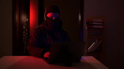 Hacker Raises Hands When Caught Using Laptop