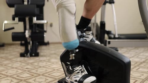 Man with Prosthetic Leg Using Exercise Bike