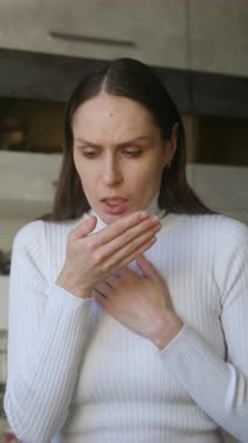 Woman Coughing Indoors Feeling Sick and Unwell