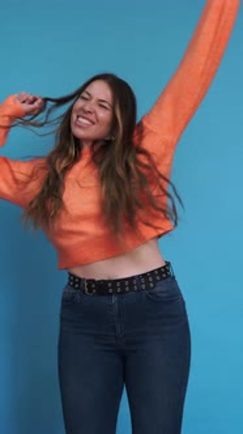 Energetic Woman Dancing in Studio Shot Vertical Video