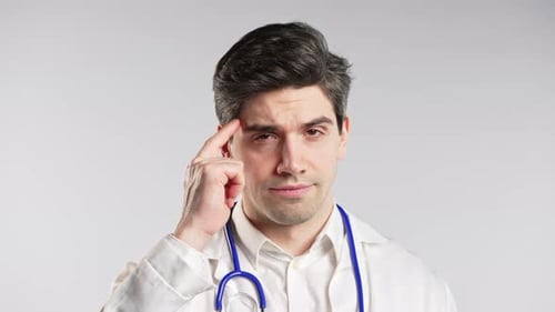 Male Doctor Remembers and Taps Temple