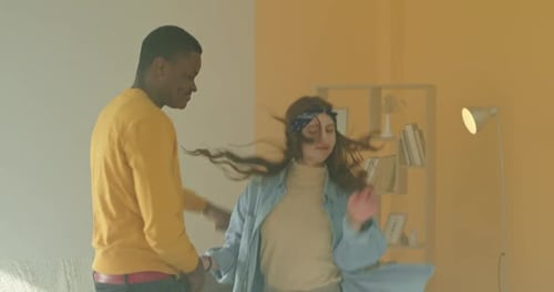 Joyful Couple Dancing and Laughing Together at Home