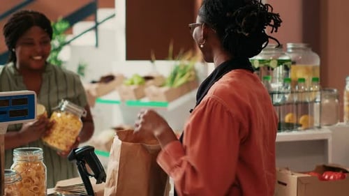 Staff Fulfills Customer Order in Cheerful General Store